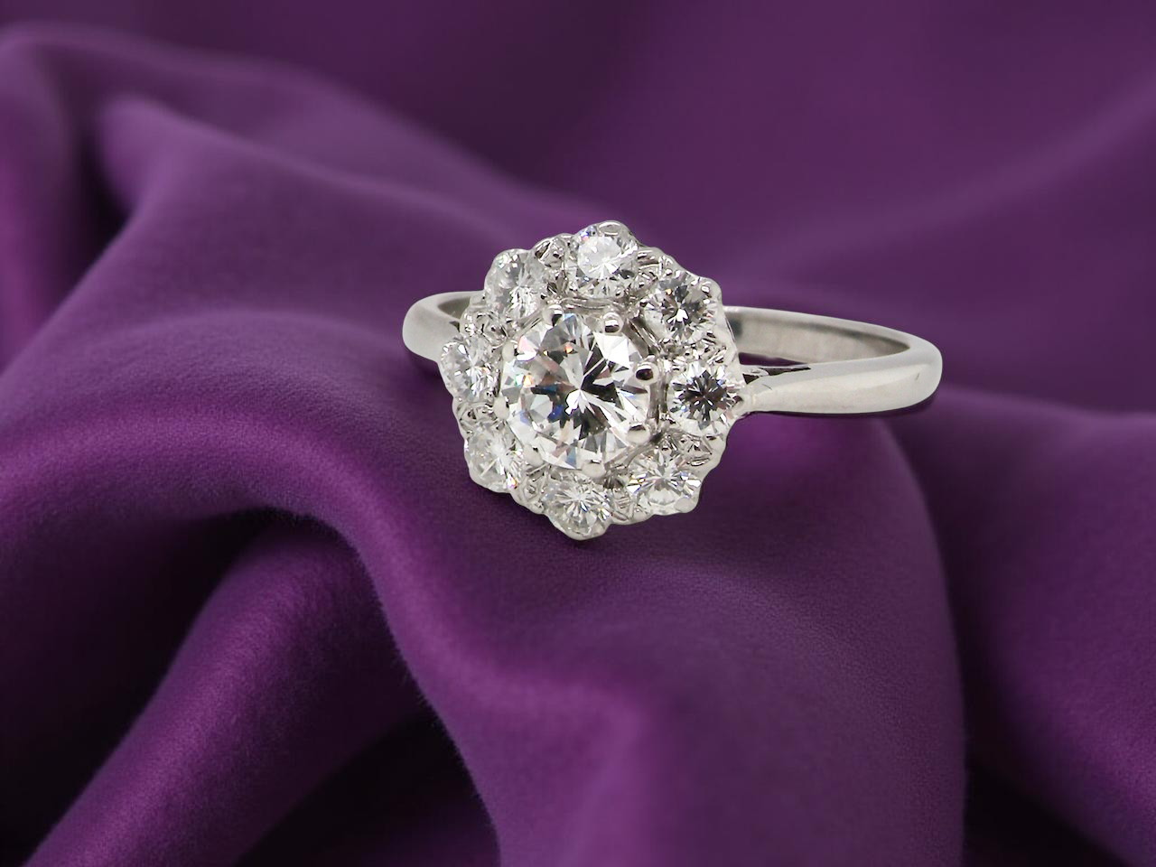 Diamond ring on a purple fabric background