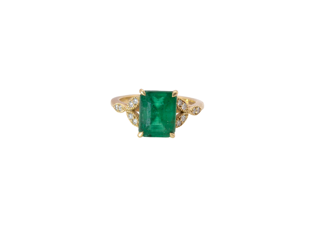 A fabulous emerald and diamond ring from the House of Fenton, beautifully crafted in 18 carat gold.