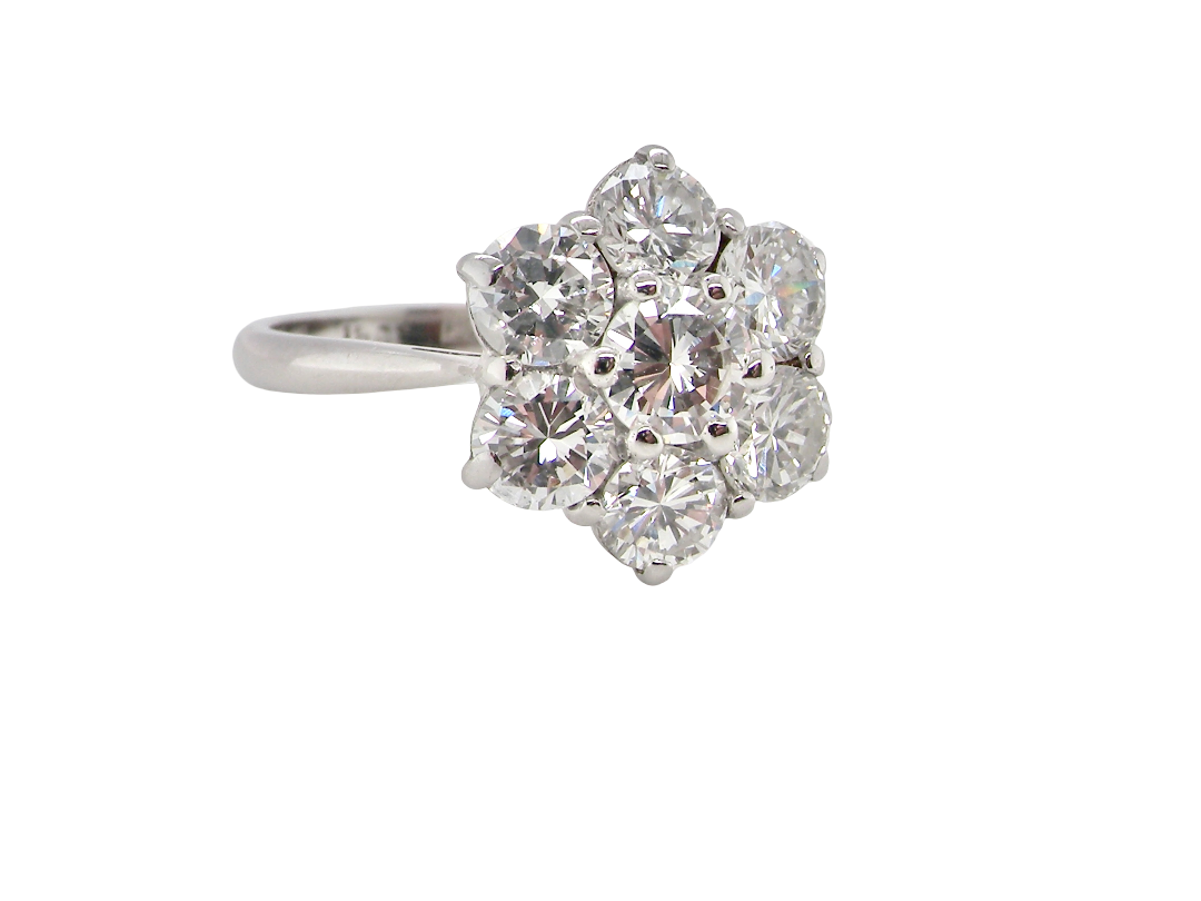 A fabulous vintage diamond cluster ring, beautifully crafted in&nbsp;18 carat white gold and set with 7 fine brilliant cut white diamonds.