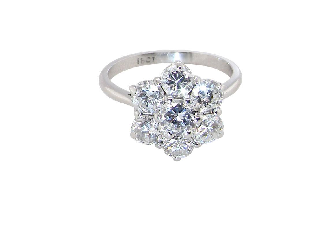 A fabulous vintage diamond cluster ring, beautifully crafted in&nbsp;18 carat white gold and set with seven fine brilliant cut diamonds.