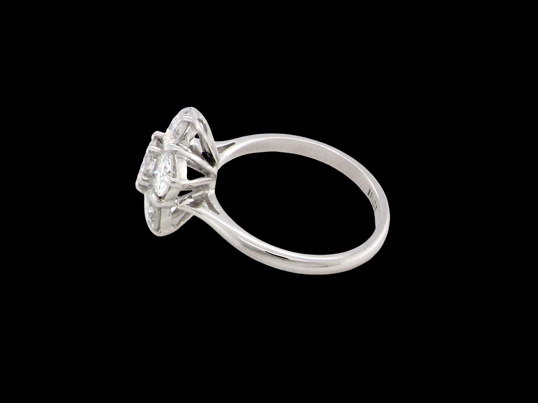 A fabulous vintage diamond cluster ring, beautifully crafted in&nbsp;18 carat white gold and set with seven fine brilliant cut white diamonds. side
