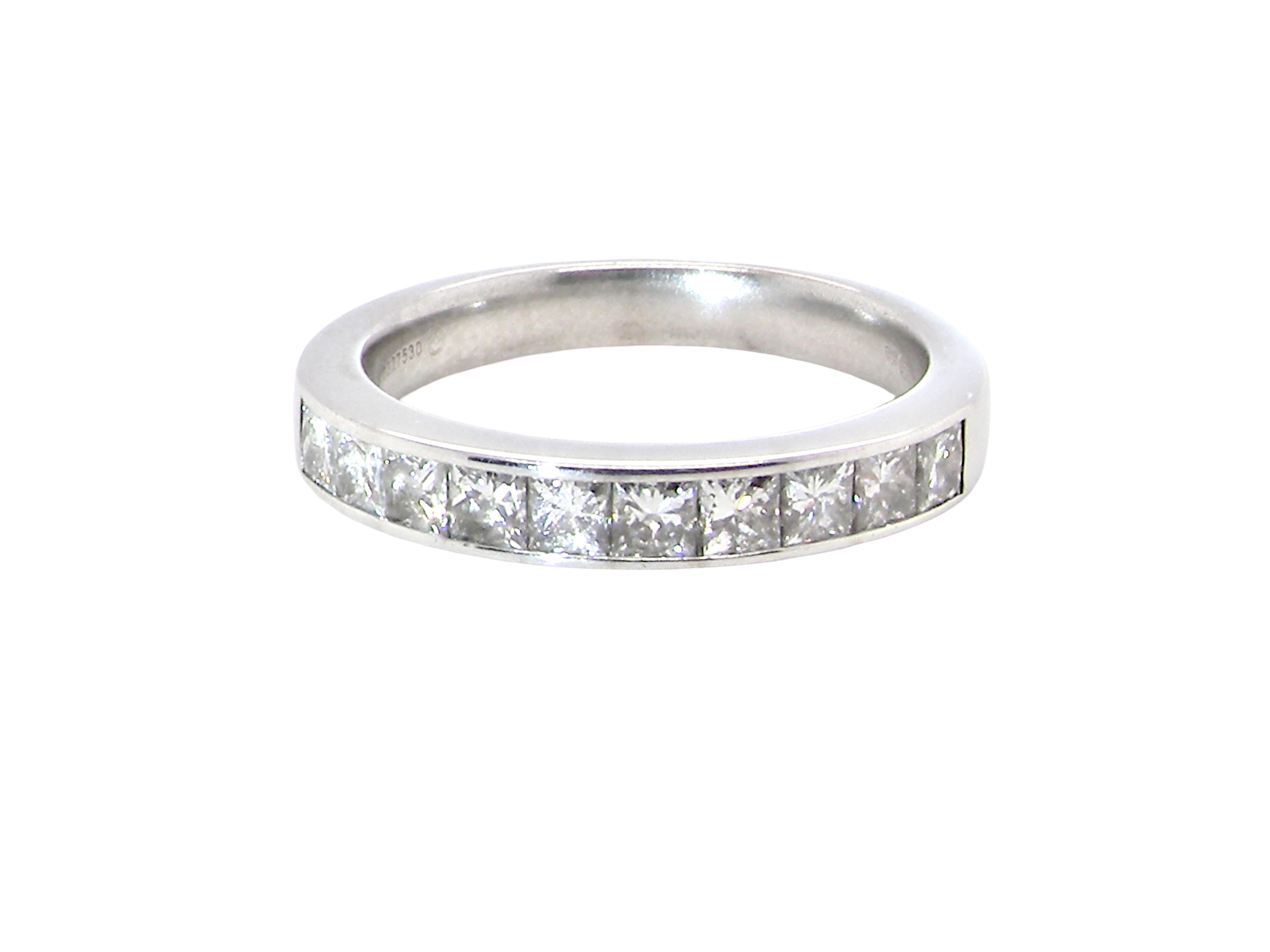 A fine 18 carat white gold half hoop eternity ring. Set with ten princess cut white diamonds.

Close set, each 2.5x2.5mm, 