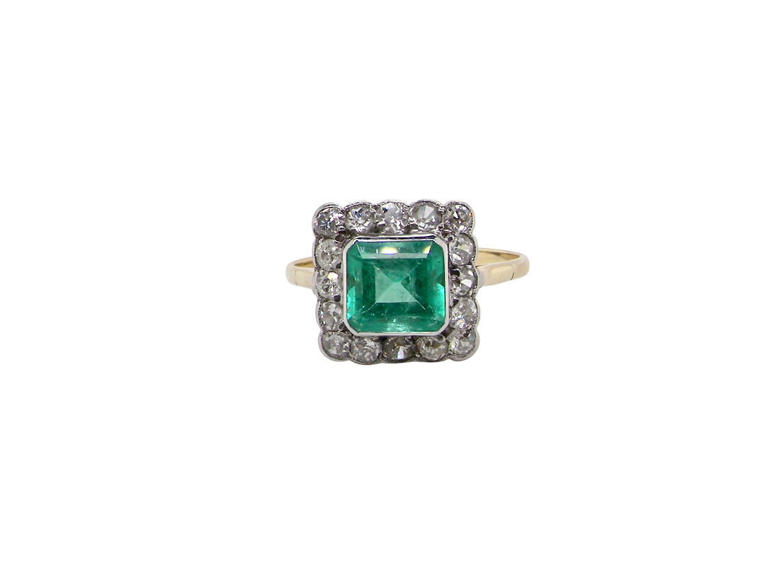 A fine Art Deco emerald and diamond cluster ring, beautifully proportioned and displaying all the elegance associated with the era