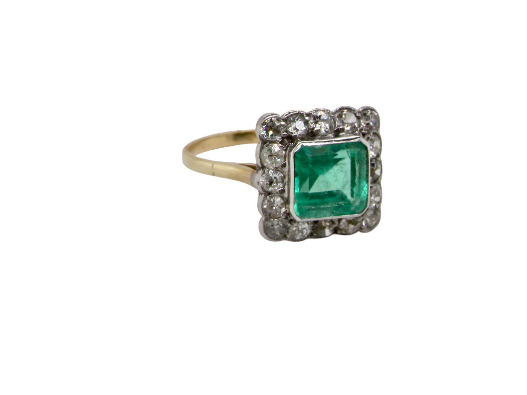 A fine Art Deco emerald and diamond cluster ring, beautifully proportioned and displaying all the elegance associated with the period. side
