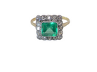 A fine Art Deco emerald and diamond cluster ring,  proportioned and displaying all the elegance associated with the period.