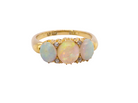 A yellow gold ring featuring three oval opal gemstones in a row, with small clear accent stones on either side of the center stone, shown against a plain white background.