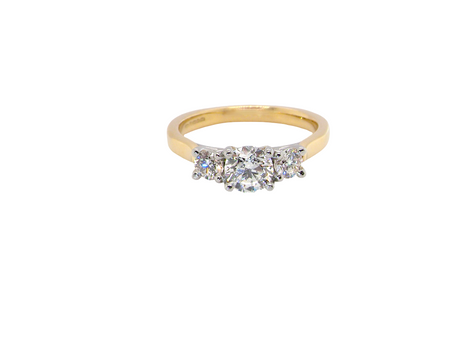 A fine and impressive three stone diamond trilogy ring, beautifully set with three graduated brilliant cut white diamonds.