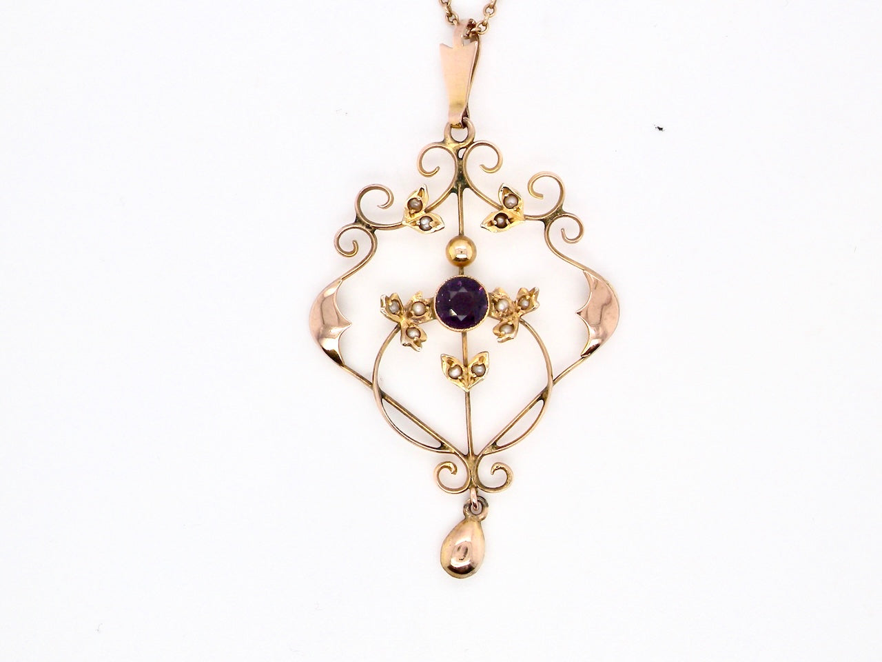 A fine antique pendant. Victorian openwork design, measures 40x30mm.