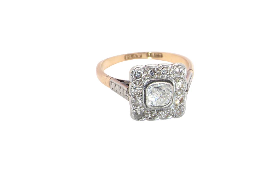 A fine antique ring from the early part of the 20th century (probably 1915-1925)

A square head that measures 11x11mm is set with old brilliant cut white diamonds. The principal stone measures just over half a carat (5.2mm) colour i-l, 
