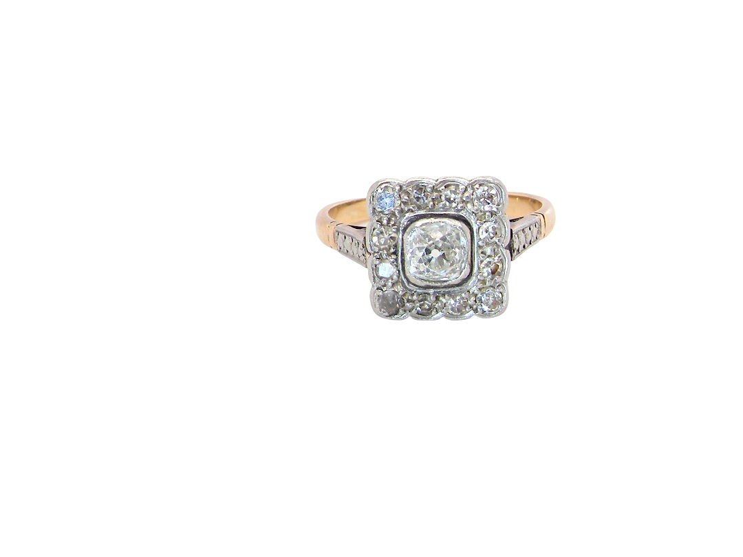 A fine antique ring from the early part of the 20th century (probably 1915-1925)

A square head that measures 11x11mm is set with old brilliant cut white diamonds. The principal stone measures just over half a carat (5.2mm) colour i-l, clarity Si, rim setting, platinum.
