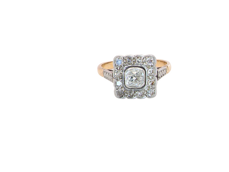 A fine antique ring from the early part of the 20th century (probably 1915-1925)

A square head that measures 11x11mm is set with old brilliant cut white diamonds. The principal stone measures just over half a carat (5.2mm) colour i-l, clarity Si, rim setting, platinum.

