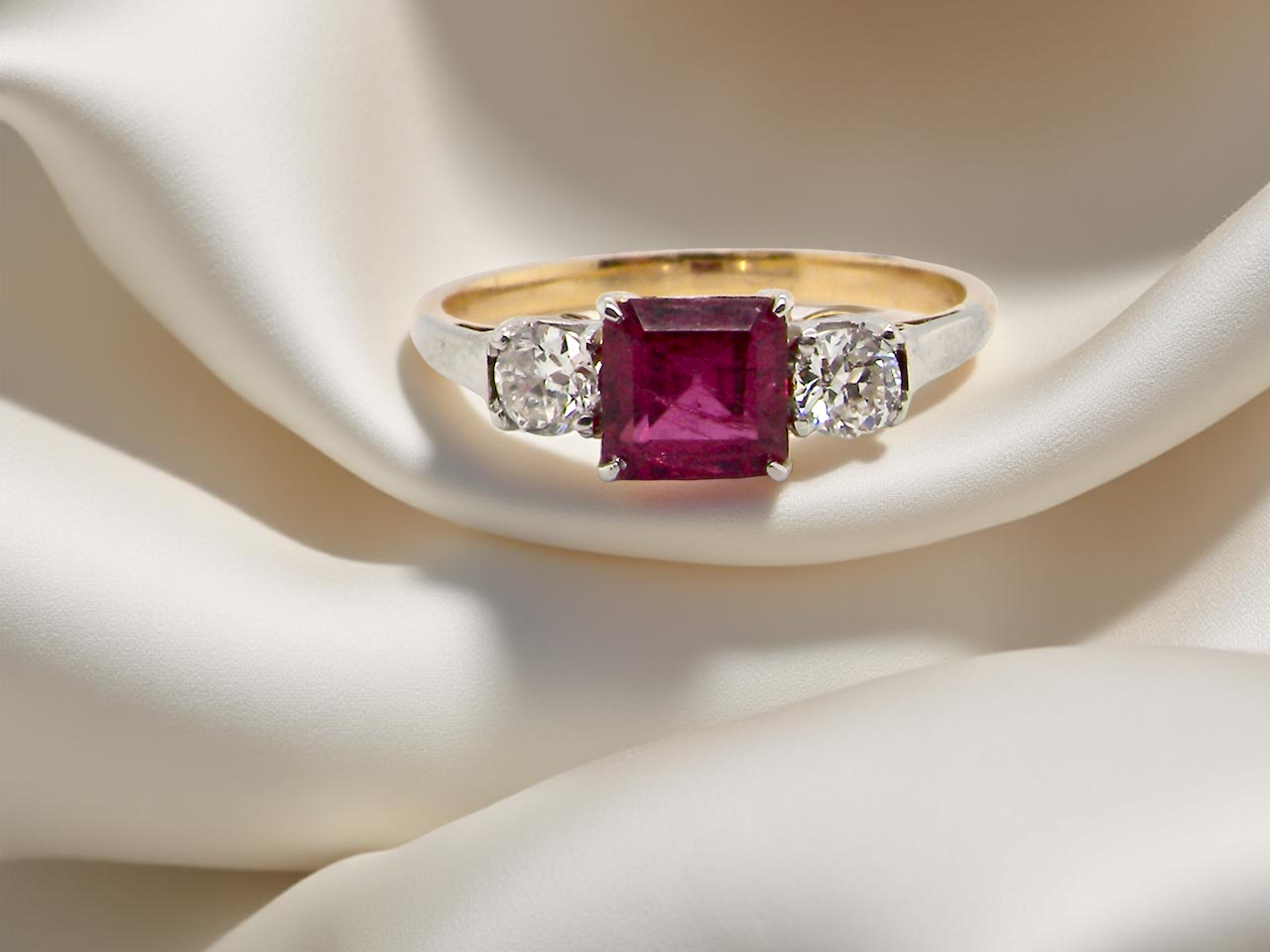 A classic Ruby and Diamond trilogy ring