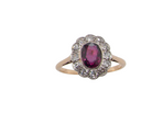 A fine early 20th century cluster ring featuring to the centre an oval ruby, 6x5mm, deep burgundy red colour, mille grain setting. (est 1.02 carats)
