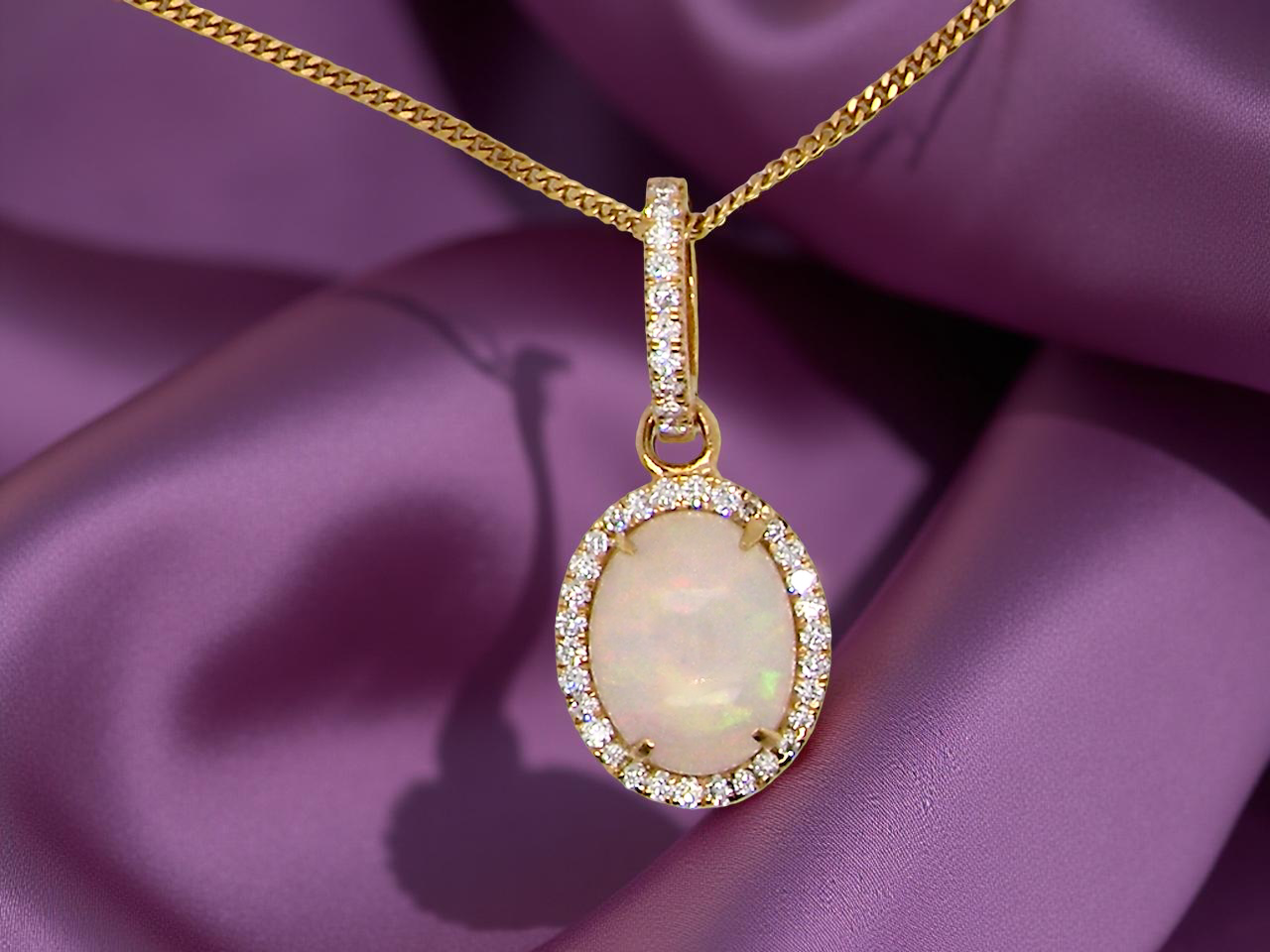 A fine opal and diamond pendant 2