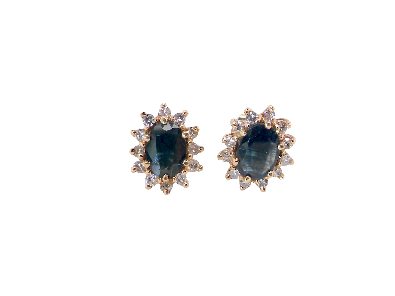 Pair of earrings with blue gemstones and gold accents on a white background
