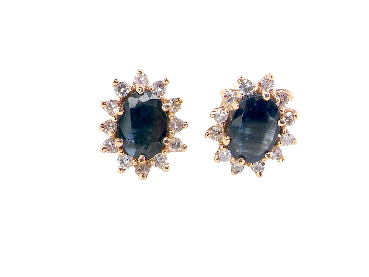 Pair of earrings with blue gemstones and gold accents on a white background