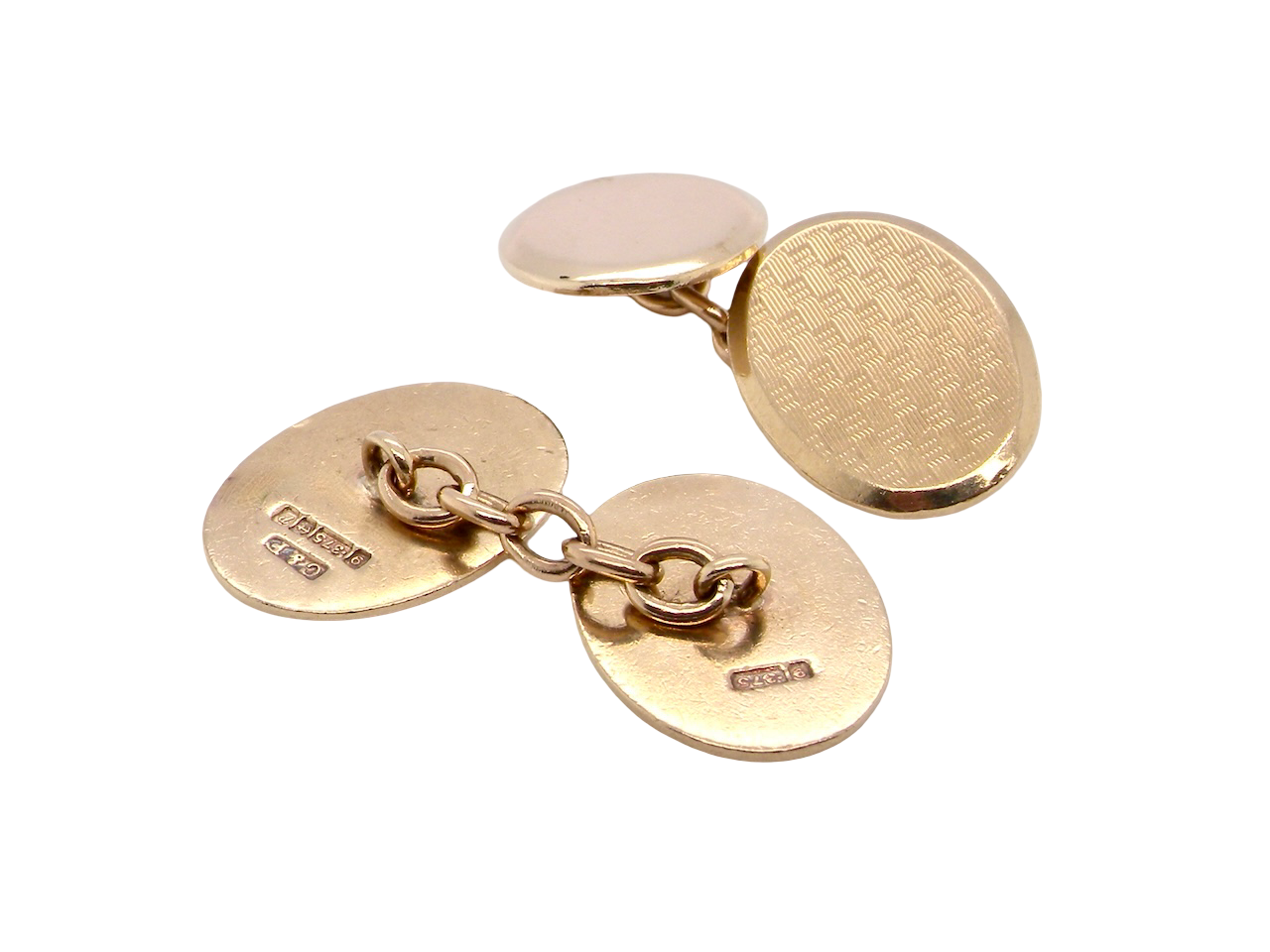 rear A fine pair of vintage 9 carat gold double cufflinks, both oval in form and measuring approximately&nbsp;20 × 14 mm.