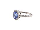 A fine platinum cluster ring with a vibrant AAA tanzanite A