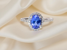 A platinum cluster ring showcasing a vibrant AAA tanzanite B