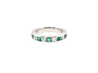A fine platinum half hoop eternity ring. This is a new ring*. Channel set gem stones, five bright green emeralds 2.6mm each (0.54 carats total)