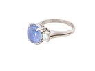 A fine platinum* ring. Features a lovely sky blue sapphire with 'star sapphire ' chatoyancy , measures 10x9mm, (est 4 carats)