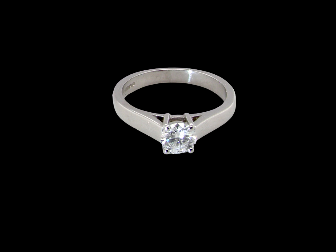 A fine solitaire ring, features an exceptional half carat diamond, brilliant cut, colour H-j, clarity VS2-Si1. Measures 5.2mm, depth 5.5mm, 