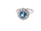 A fine vintage cluster ring centred with a deep blue aquamarine, measuring approximately 8mm 