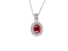 A fine white gold pendant that features to the centre an oval facet cut ruby, 8x6mm (est 1.25 carats) good deep red colour.
