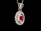 A fine white gold pendant that features to the centre an oval facet cut ruby, 8x6mm (est 1.25 carats) good deep red colour.
sidew