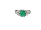 A fine white gold* ring that features a rectangular emerald centre stone, measures 6x6.5mm (est one carat), mid to dark green hue, natural inclusions as with most emeralds.
