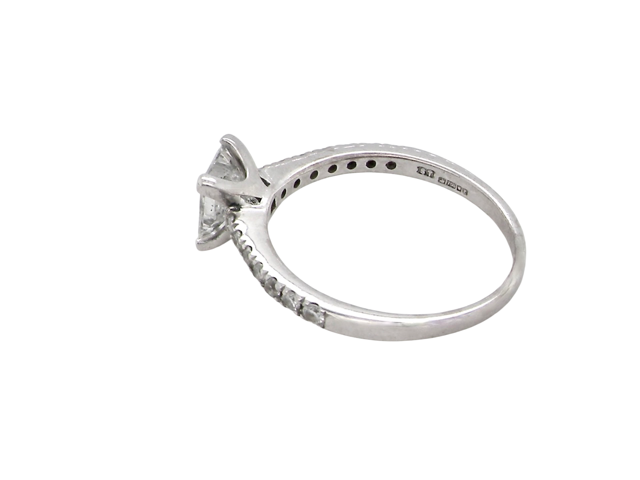 Diamond ring with a white gold band on a white background