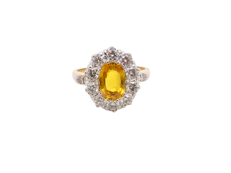 A fine yellow sapphire and diamond cluster ring