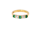 A five stone ring set with three emeralds, each 3mm diameter.

Between each two brilliant cut white diamonds, each 3.4mm (0.15 carats each est), colour i-j, clarity Si.
