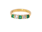 A five stone ring set with three emeralds, each 3mm diameter.

Between each two brilliant cut white diamonds, each 3.4mm (
