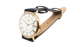 A gentleman's 9 carat gold wrist watch. Plain white dial with roman numerals, sweep seconds hand, and a calendar date window.

Case measures 32mm. Signed by Rotary.
