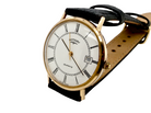 A gentleman's 9 carat gold wrist watch. Plain white dial with roman numerals, sweep seconds hand, and a calendar date window.
 Quartz movement. Signed by Rotary.
