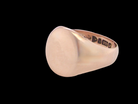 A gentleman's 9 carat rose gold signet ring. The head is oval shaped 13x13mm, totally plain 