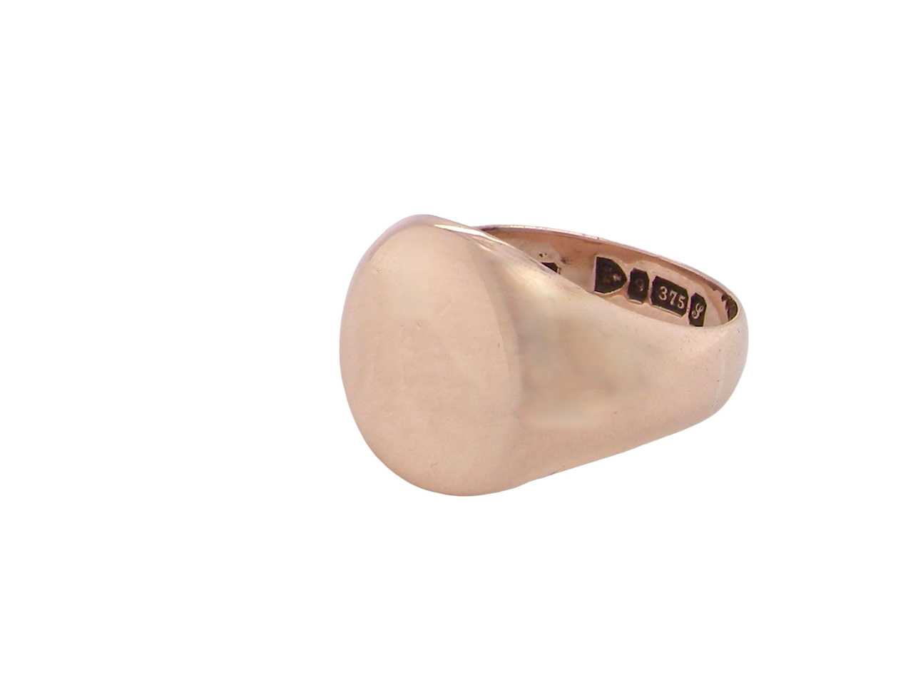 A gentleman's 9 carat rose gold signet ring. The head is oval shaped 13x13mm, totally plain with a seamless surface to the shoulders.