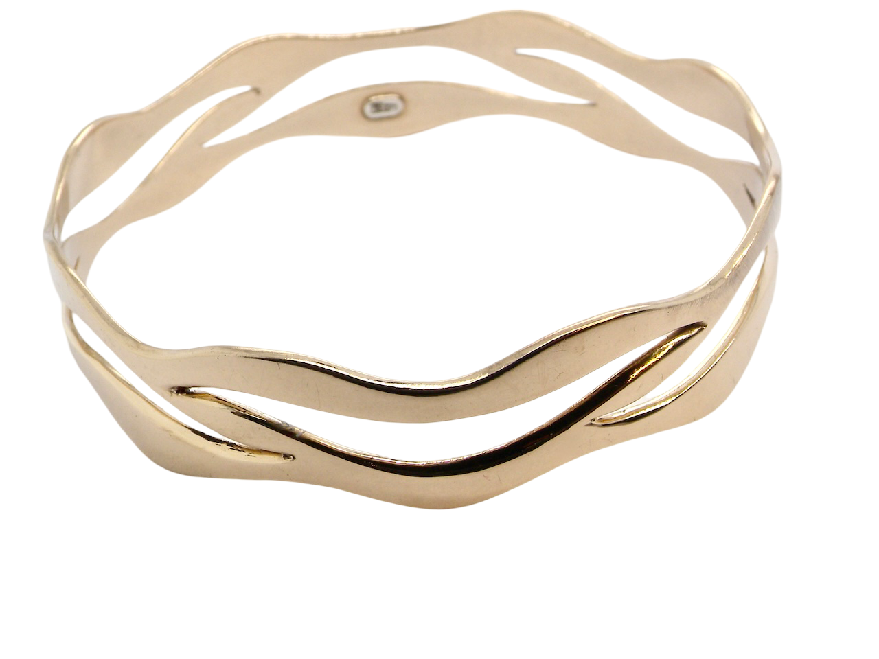 A gold cut out style bangle
