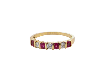 An 18 carat gold Ruby and Diamond eternity ring