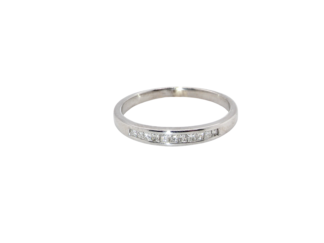 A half hoop 9 carat white gold eternity ring.

Channel set with eleven Princess cut white diamonds,