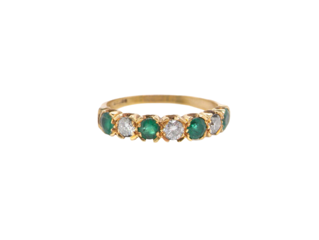 A half hoop Emerald and Diamond ring