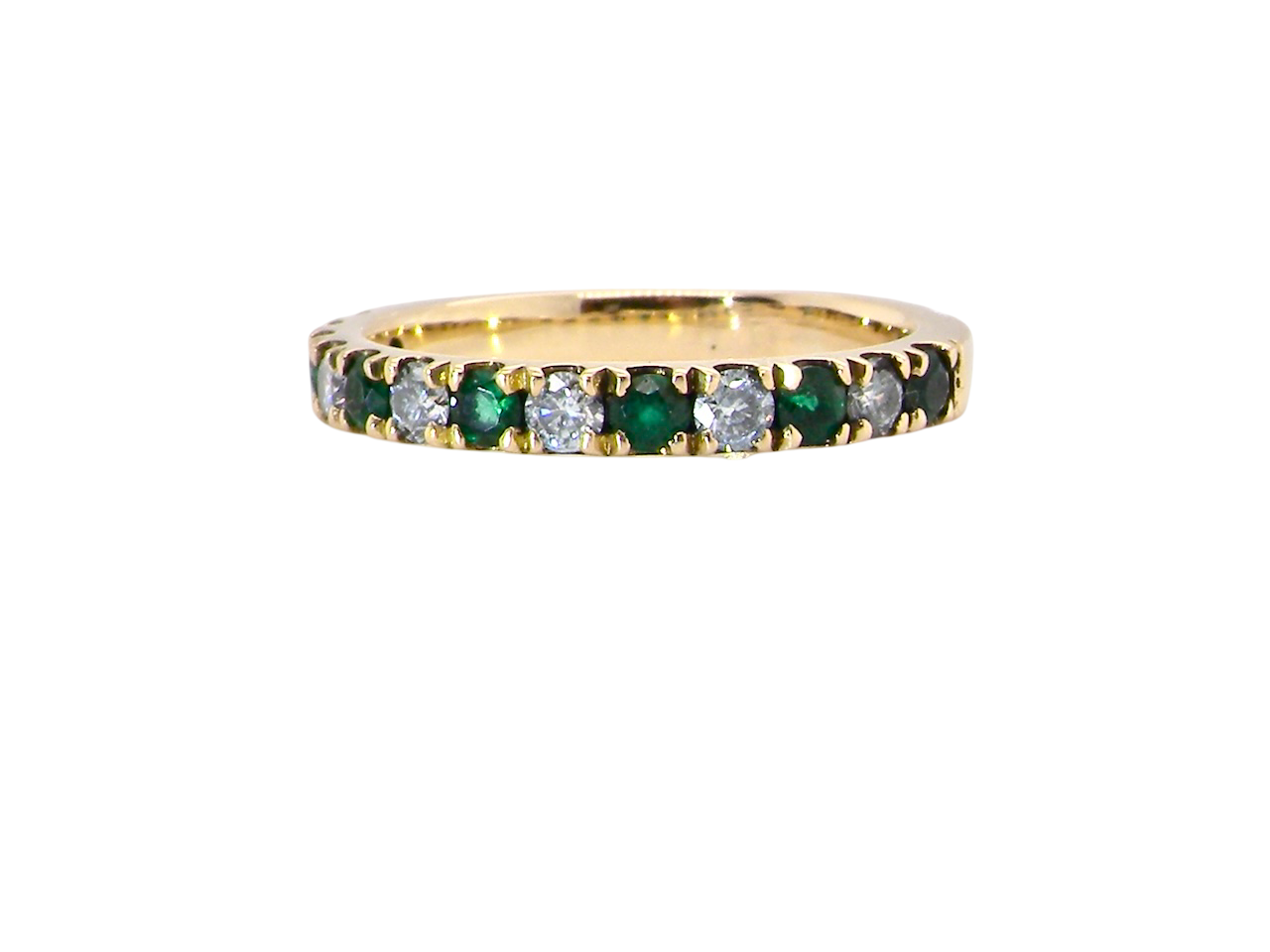 A half hoop eternity ring. Set with seven emeralds,A