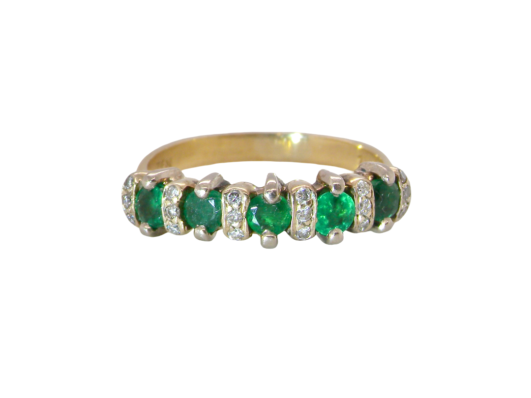 A half hoop ring, stamped 750 (testing as 18 carat gold)&nbsp;

Set with alternate gemstones, five emeralds