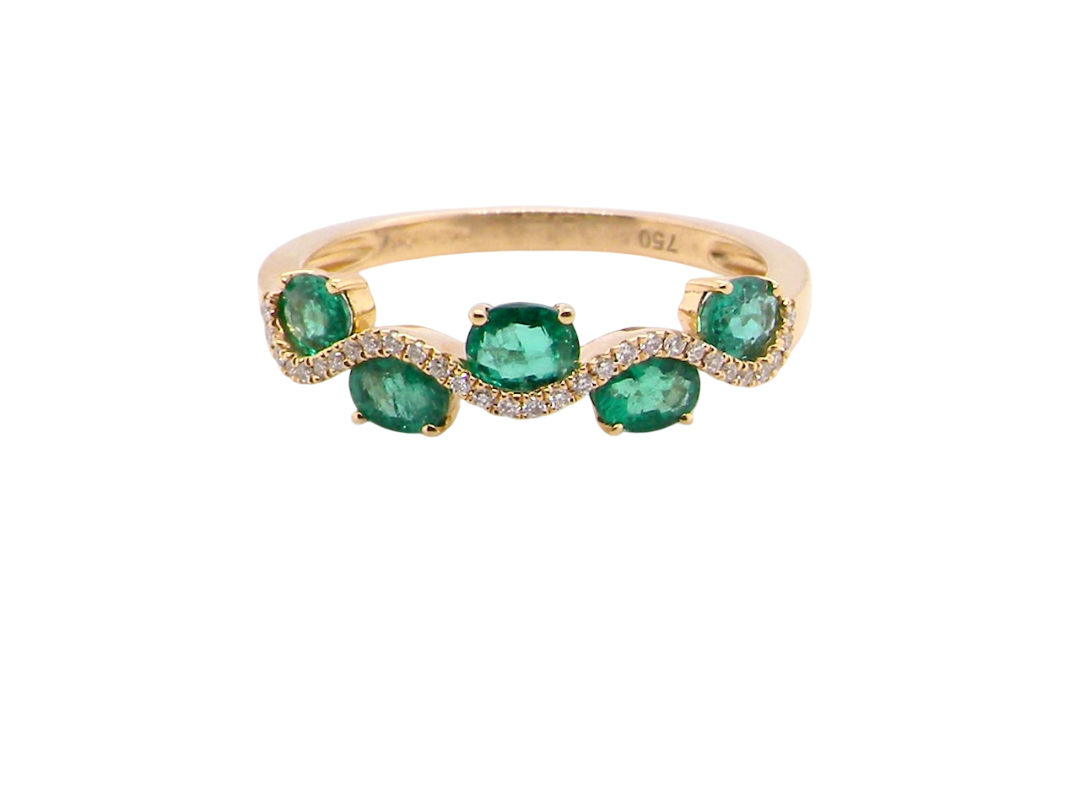 A half hoop ring with a very attractive line of oval cut emeralds, each 4x3mm, a lovely deep grass green hue, and with very good clarity too.
