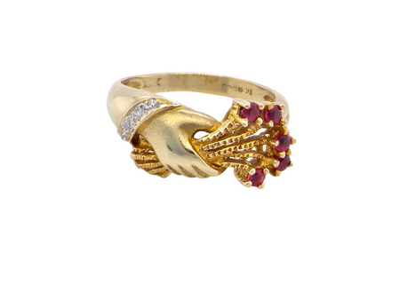 A  hand ring set with diamonds and rubies