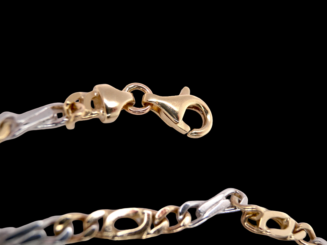 Figaro A heavy 9 carat gold neck chain. Two colour gold, white and yellow