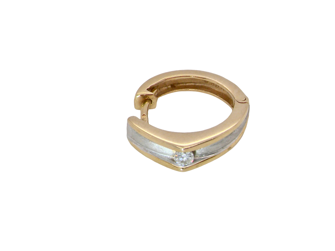 A small gold huggie hoop earring with a channel-set silver inlay and a single round clear gemstone at the front, shown on a plain white background.