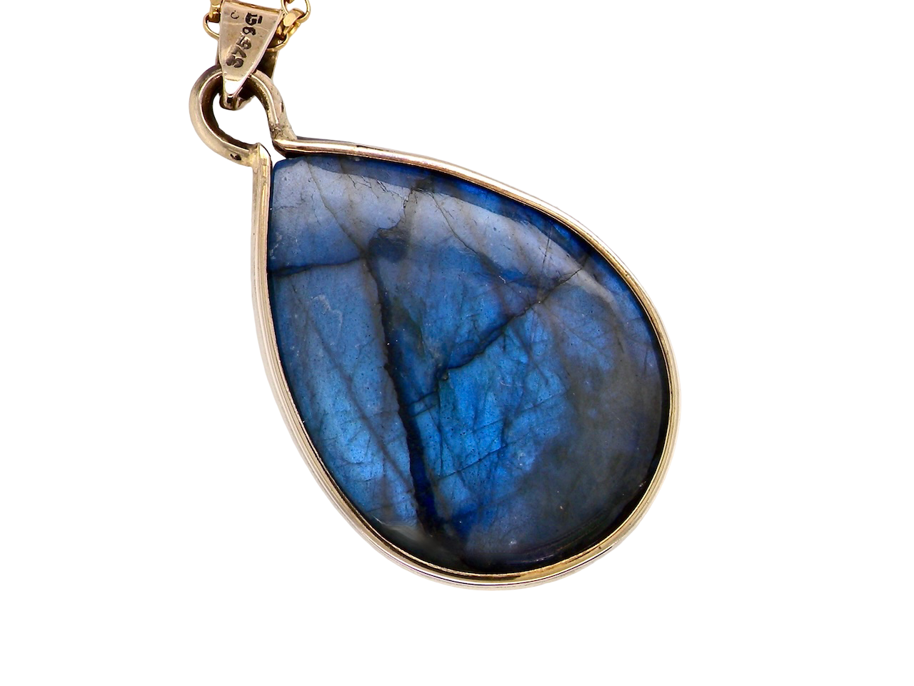Teardrop-shaped blue gemstone pendant on a gold chain against a white background