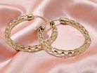 A large pair of 9 carat gold hoop earrings.

Diameter 35mm, 